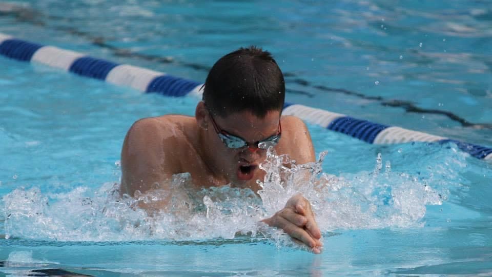 Swimmer doing breaststroke at Atlee Recreation pool